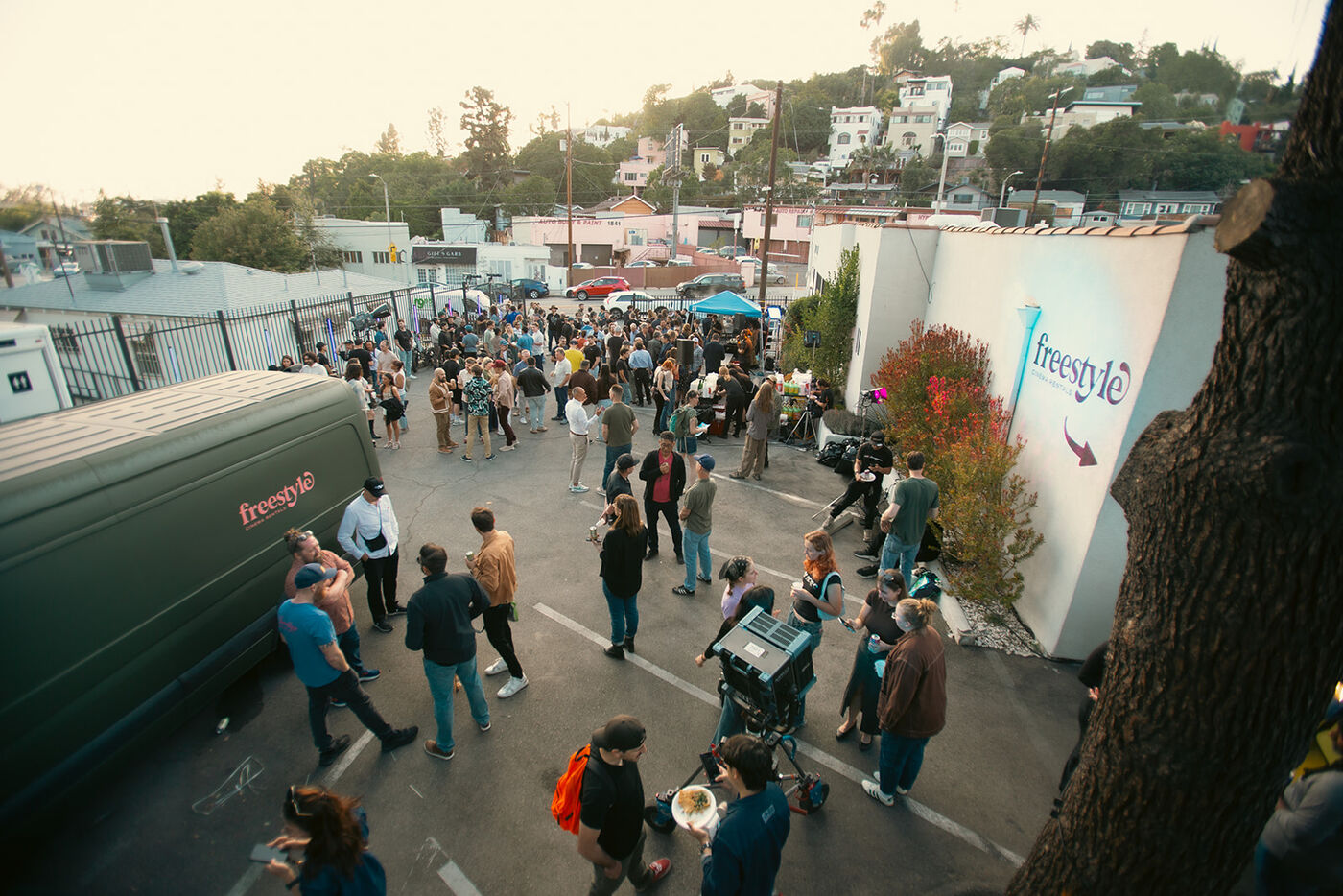 Guests gather in the lot outside Freestyle Cinema Rentals